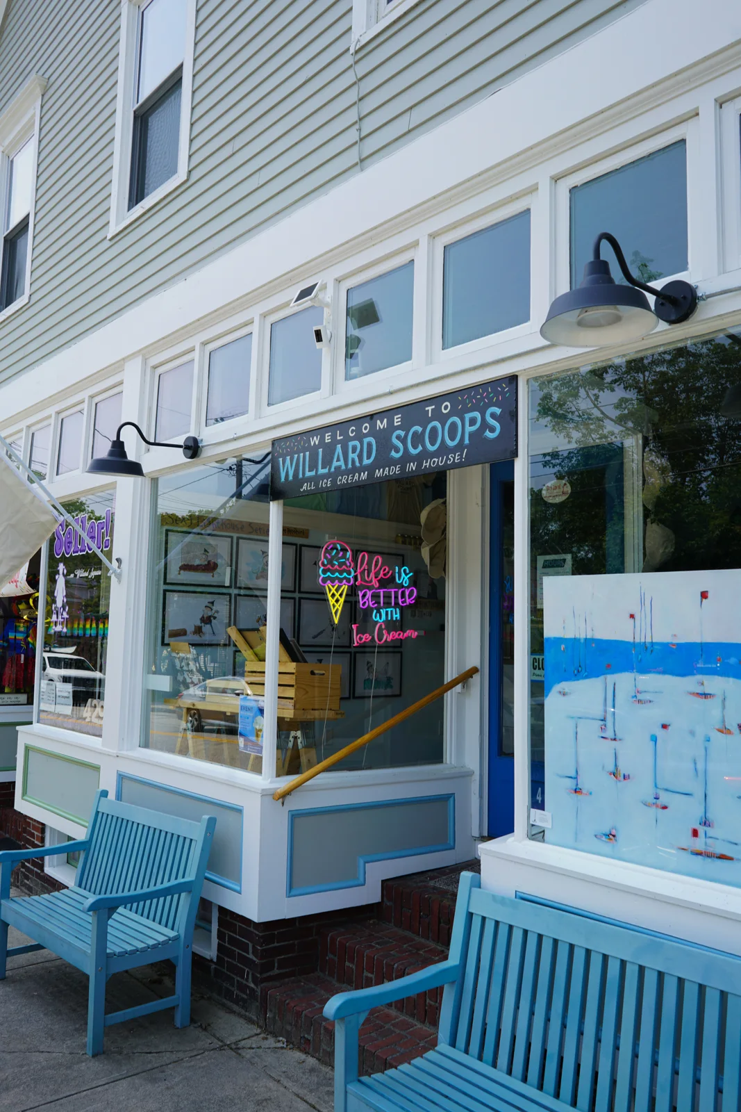 The blue Willard Scoops storefront and bench on Preble Street